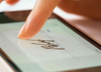 46293960 sign document of deal on digital gadget close up (1)